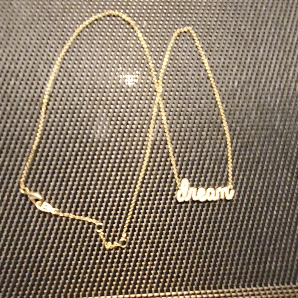 dream with small cz's.Gold tone chain, very dainty